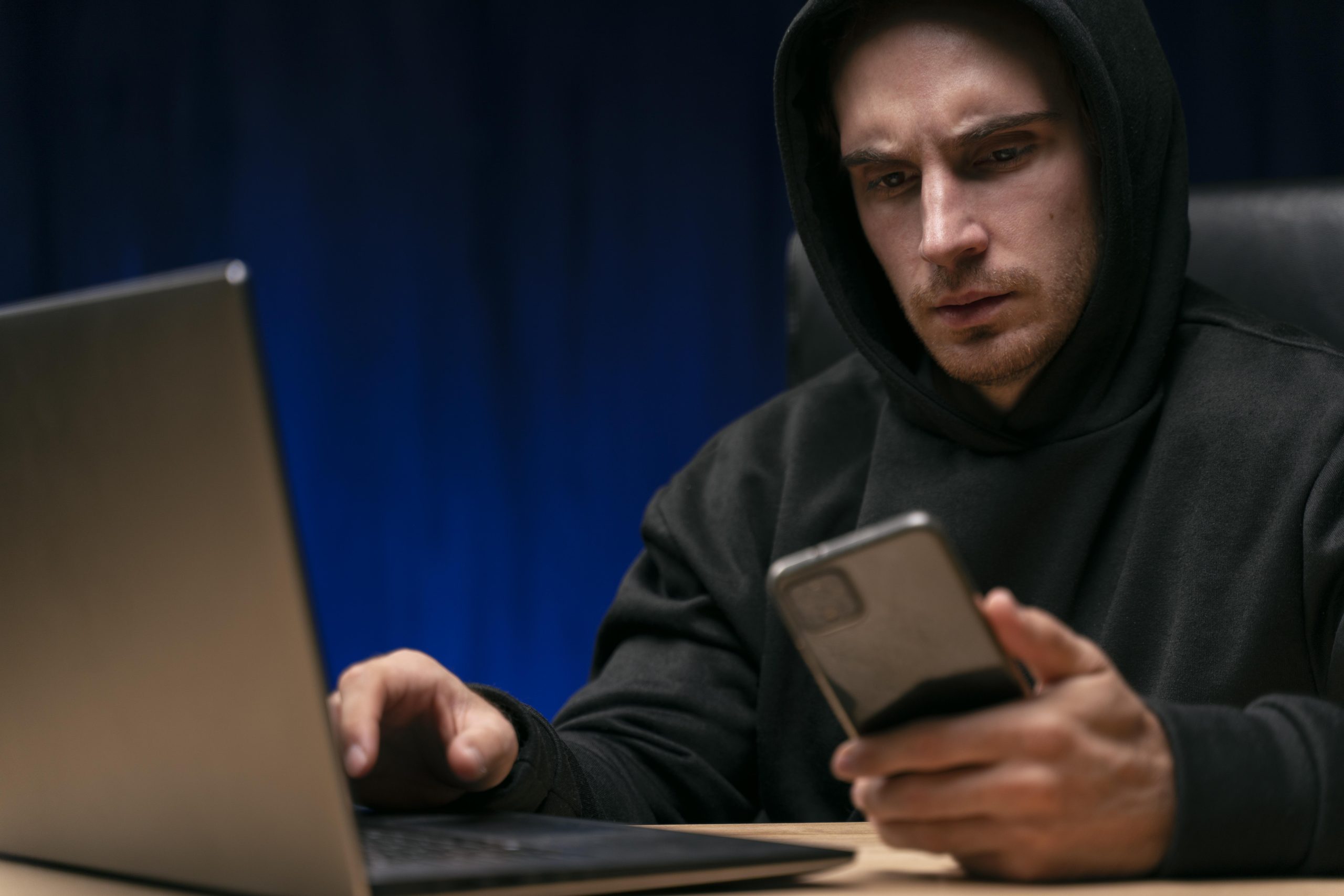 concerned man with devices close up scaled